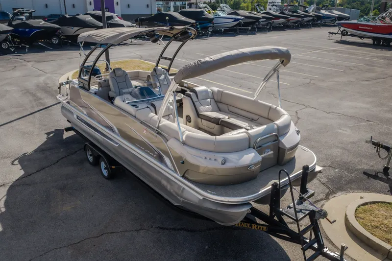 Slide: The Image of 2017 Princecraft Vogue 25 XT pontoon boat on trailer in parking lot. - 12