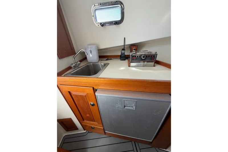 Slide: The Image of Compact galley in 2000 Webber's Cove Pemaquid Beach boat with sink, stove, and fridge. - 23