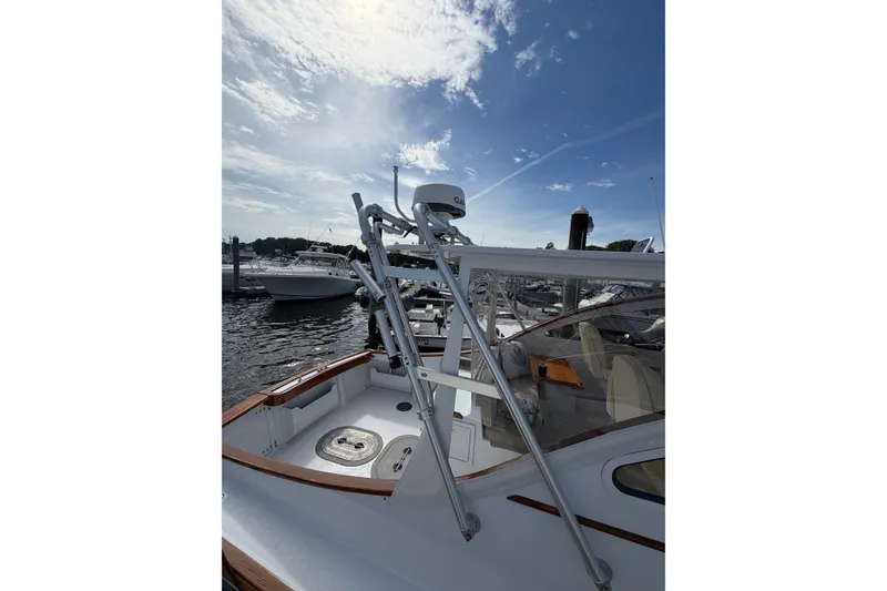 Slide: The Image of Webber's Cove Pemaquid Beach 2000 boat docked under a partly cloudy sky. - 13