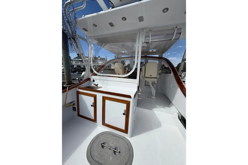 Slide: The Image of 2000 Webber's Cove Pemaquid Beach boat interior with white cabinetry and seating. - 16