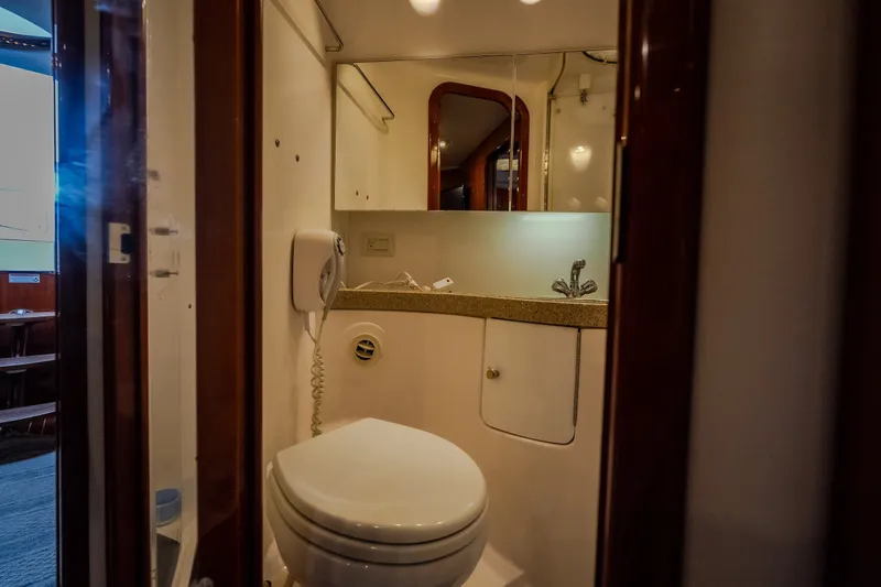 Slide: The Image of Bathroom interior of 2009 Regal Commodore 4460 yacht with sink and toilet. - 48