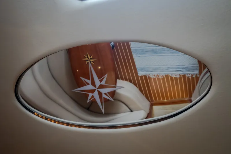 Slide: The Image of Interior of 2009 Regal Commodore 4460 yacht with compass rose design. - 42
