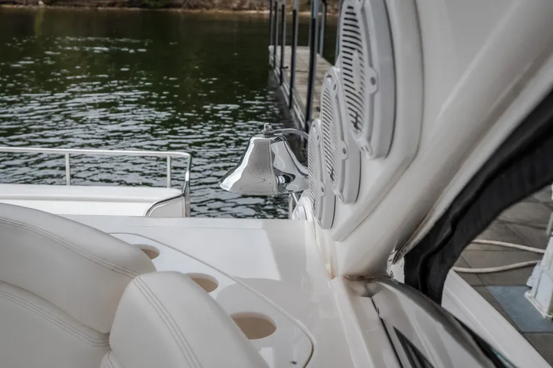 Slide: The Image of 2009 Regal Commodore 4460 yacht interior with speakers and water view. - 16