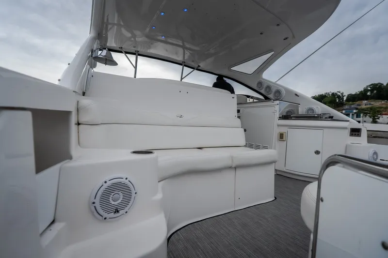 Slide: The Image of Luxurious 2009 Regal Commodore 4460 yacht interior with white seating and modern amenities. - 11