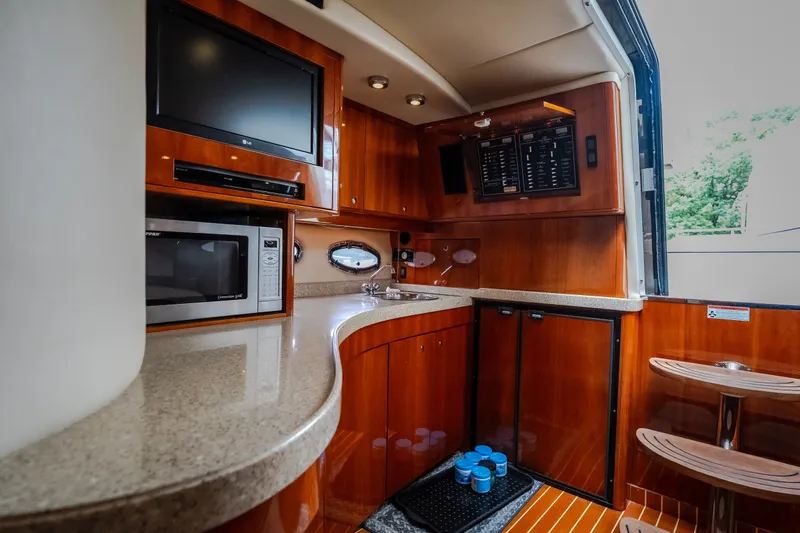 Slide: The Image of Luxurious 2009 Regal Commodore 4460 yacht interior with modern kitchen amenities. - 40
