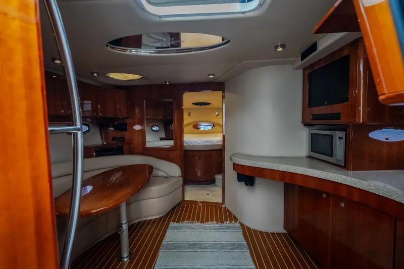 Slide: The Image of Luxurious interior of 2009 Regal Commodore 4460 yacht with modern amenities and elegant wood finishes. - 37