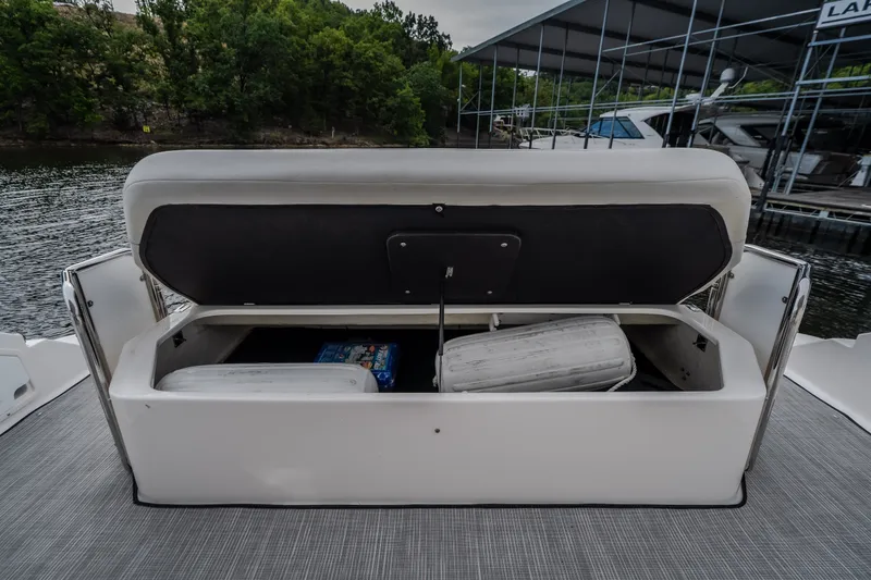 Slide: The Image of Open storage compartment on 2009 Regal Commodore 4460 boat, dockside view. - 10