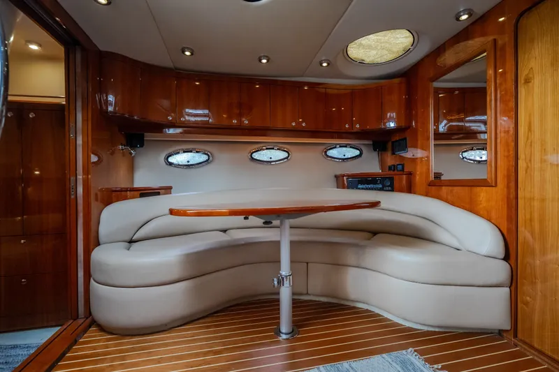 Slide: The Image of Luxurious interior of 2009 Regal Commodore 4460 yacht with elegant wood finish and plush seating. - 38