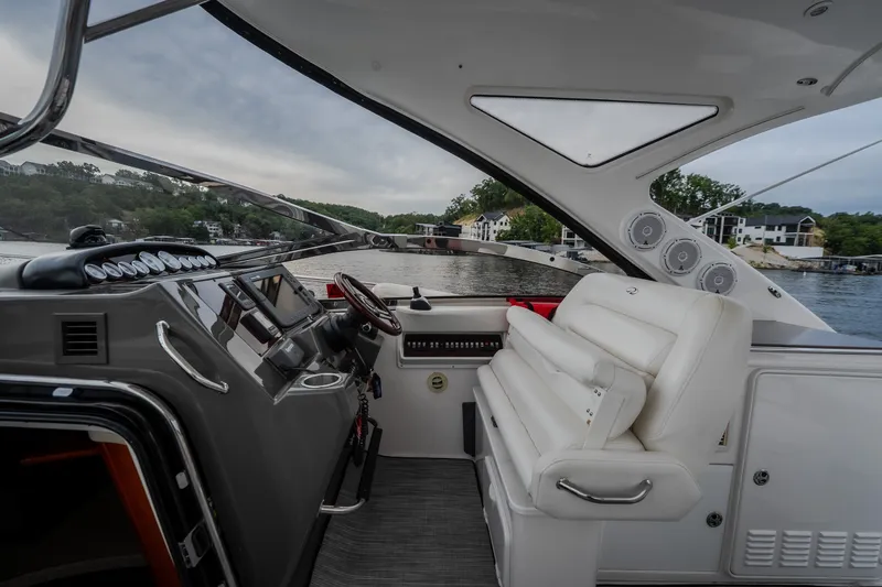 Slide: The Image of Luxurious 2009 Regal Commodore 4460 yacht interior with sleek dashboard and plush seating. - 20