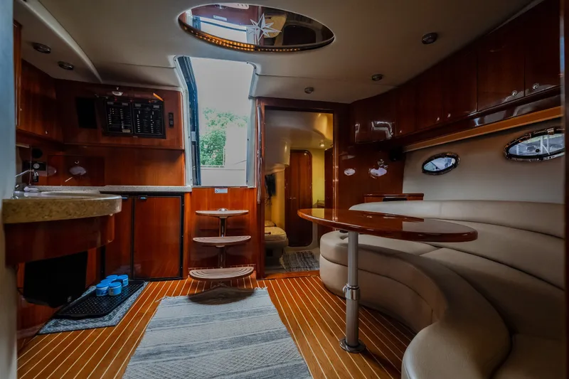 Slide: The Image of Luxurious interior of 2009 Regal Commodore 4460 yacht with elegant wood finishes and seating. - 44
