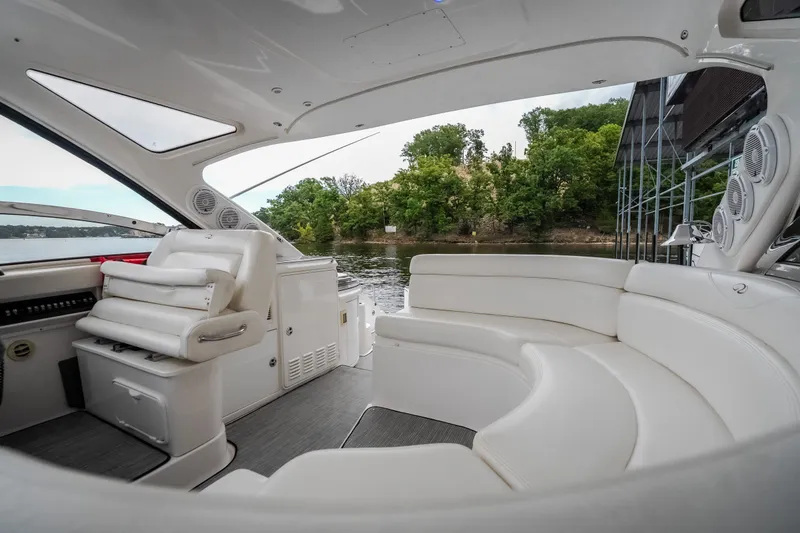 Slide: The Image of Luxurious interior of 2009 Regal Commodore 4460 yacht with white seating and scenic water view. - 15