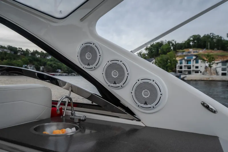 Slide: The Image of Interior of 2009 Regal Commodore 4460 yacht with speakers and sink. - 13