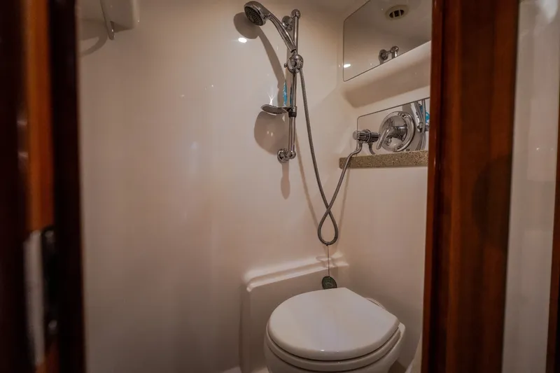 Slide: The Image of Bathroom interior of 2009 Regal Commodore 4460 yacht with shower and toilet. - 52