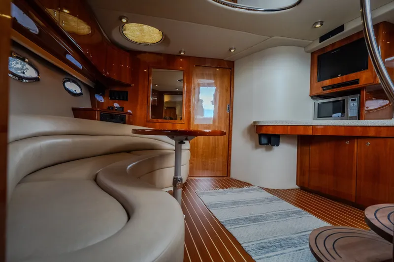 Slide: The Image of Luxurious interior of a 2009 Regal Commodore 4460 yacht with elegant wood finishes. - 45