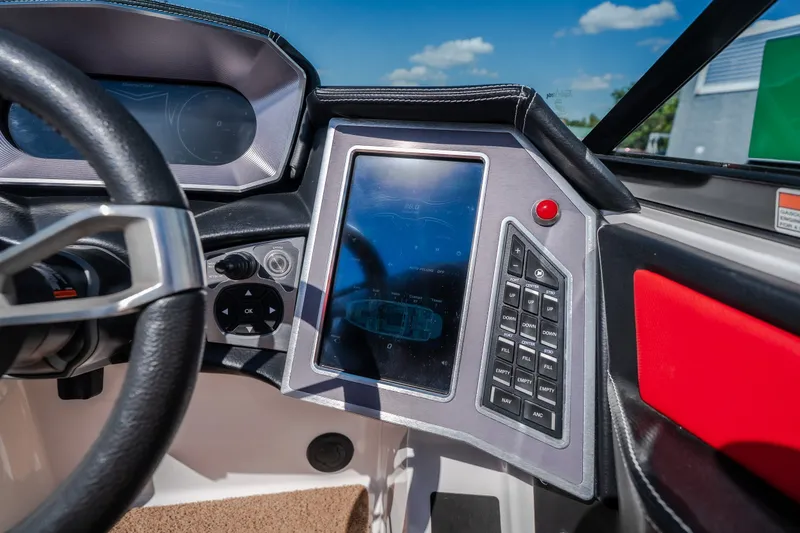 Slide: The Image of 2020 MasterCraft X26 dashboard with touchscreen controls and steering wheel. - 36