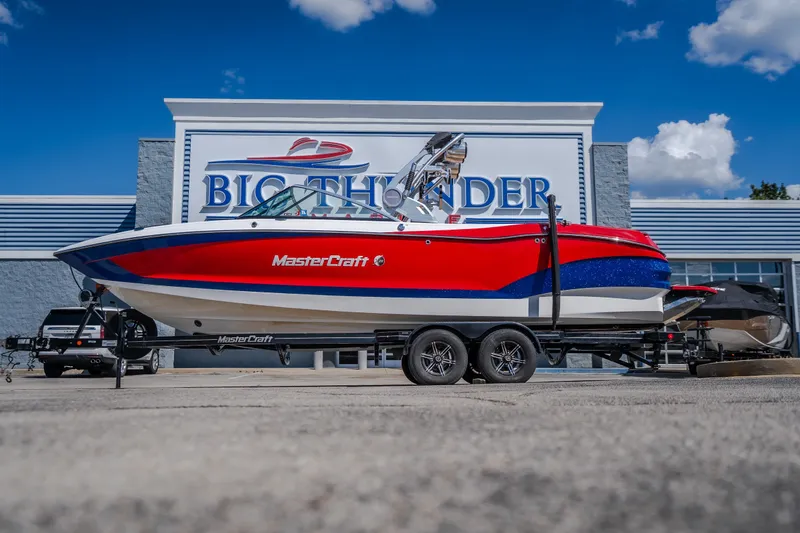 Slide: The Image of 2020 MasterCraft X26 boat on trailer at Big Thunder dealership. - 2