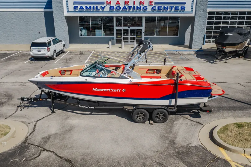 Slide: The Image of 2020 MasterCraft X26 boat in vibrant red, parked at Marine Family Boating Center. - 5