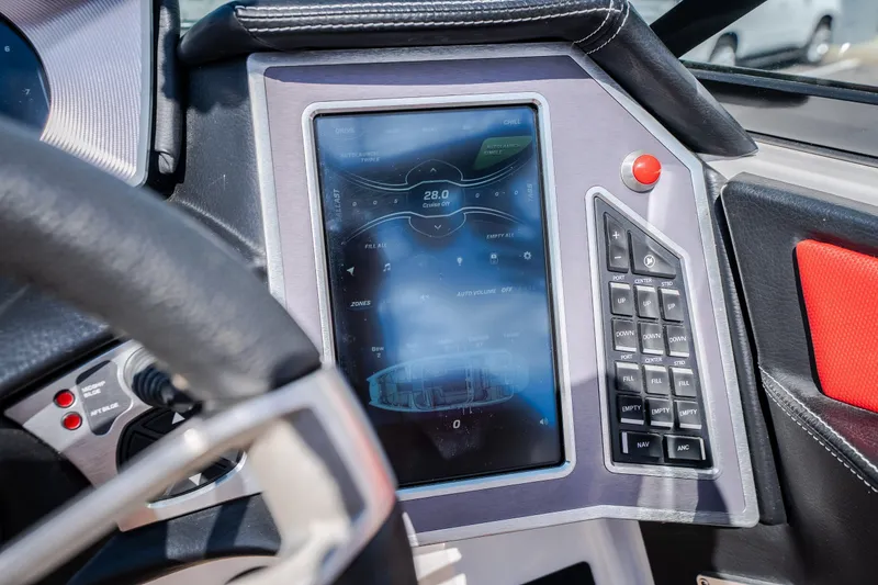 Slide: The Image of Dashboard of a 2020 MasterCraft X26 boat featuring a touchscreen control panel. - 35
