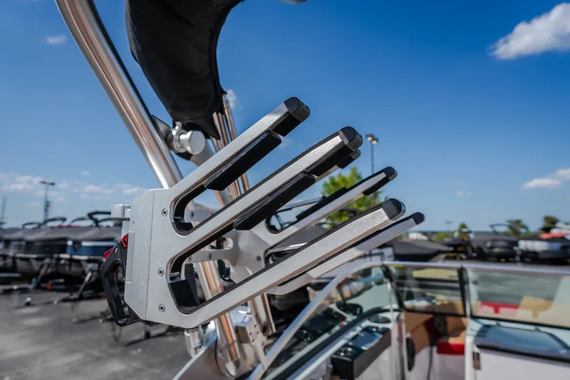 Slide: The Image of Wakeboard rack on a 2020 MasterCraft X26 boat under a clear blue sky. - 20