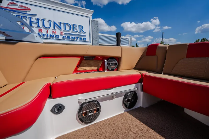 Slide: The Image of 2020 MasterCraft X26 boat interior with red and beige seating at Thunder Marine Center. - 46