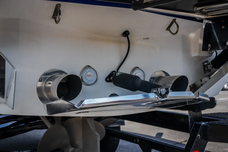 Slide: The Image of Rear view of a 2020 MasterCraft X26 boat, showcasing exhaust and propeller details. - 9