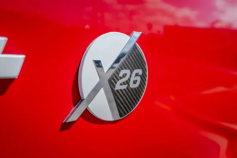 Slide: The Image of 2020 MasterCraft X26 logo on vibrant red background. - 10