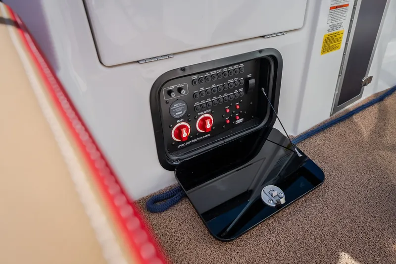 Slide: The Image of 2020 MasterCraft X26 boat control panel with switches and red knobs. - 33