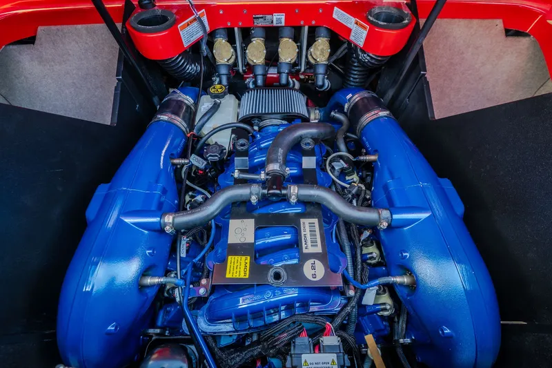 Slide: The Image of 2020 MasterCraft X26 engine with blue components and red accents. - 56