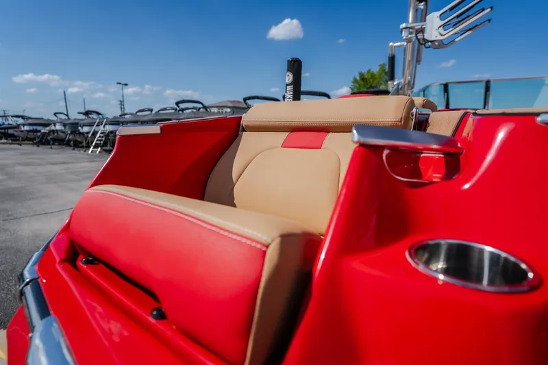 Slide: The Image of Red and tan seating on 2020 MasterCraft X26 boat under blue sky. - 15