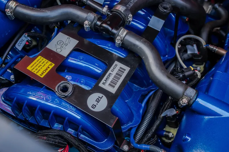 Slide: The Image of 2020 MasterCraft X26 engine, featuring a blue 6.2L Ilmor motor with visible hoses and components. - 55