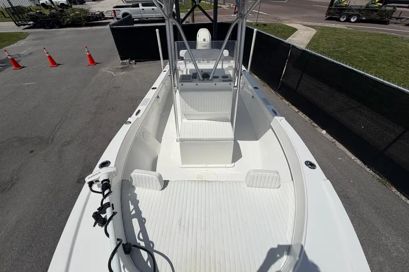 Slide: The Image of 2021 Dusky 227 Open Fisherman boat, spacious deck, parked outdoors. - 44