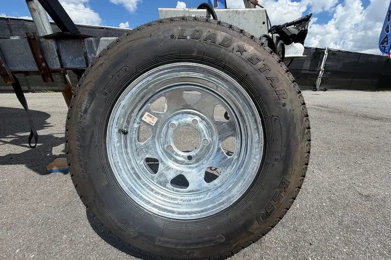 Slide: The Image of Trailer wheel with Loadstar tire on a Dusky 227 Open Fisherman, 2021 model. - 66
