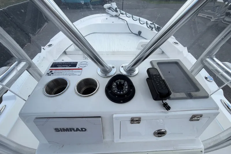 Slide: The Image of Control panel of 2021 Dusky 227 Open Fisherman boat with compass and Simrad equipment. - 29