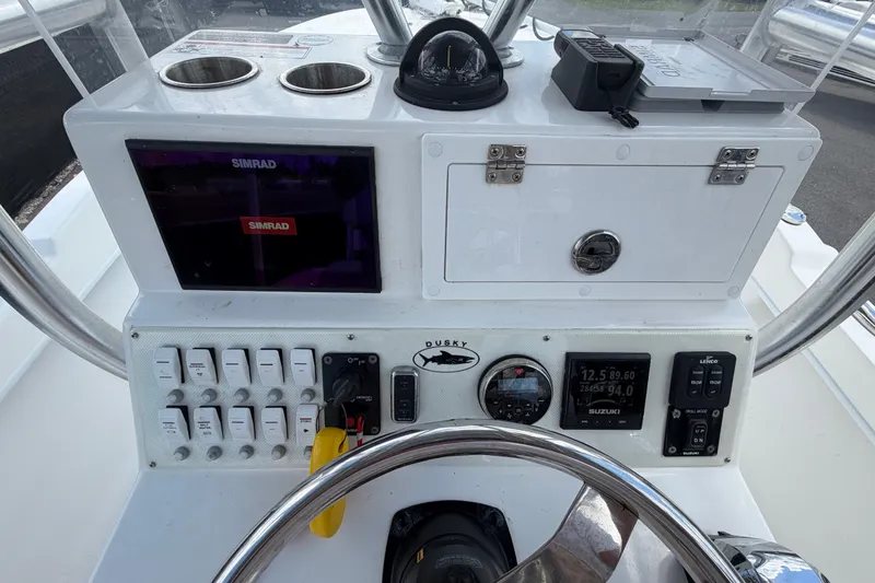 Slide: The Image of Dashboard of 2021 Dusky 227 Open Fisherman boat with Simrad electronics and controls. - 22