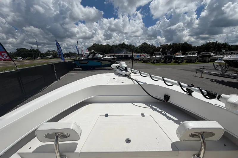 Slide: The Image of 2021 Dusky 227 Open Fisherman boat on display under cloudy sky. - 34