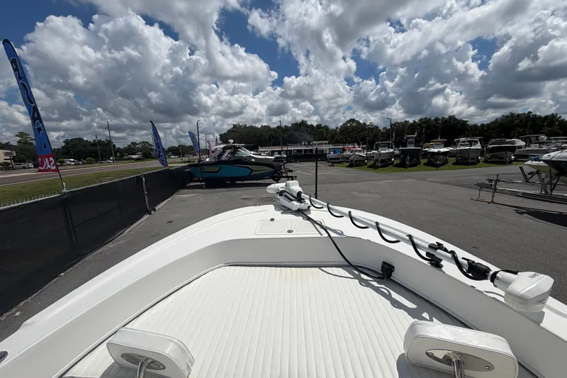 Slide: The Image of 2021 Dusky 227 Open Fisherman boat on display under a cloudy sky. - 33