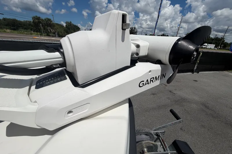 Slide: The Image of Garmin trolling motor on 2021 Dusky 227 Open Fisherman boat under a cloudy sky. - 42