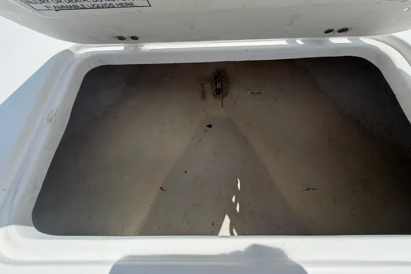 Slide: The Image of Open storage compartment on a 2021 Dusky 227 Open Fisherman boat. - 39
