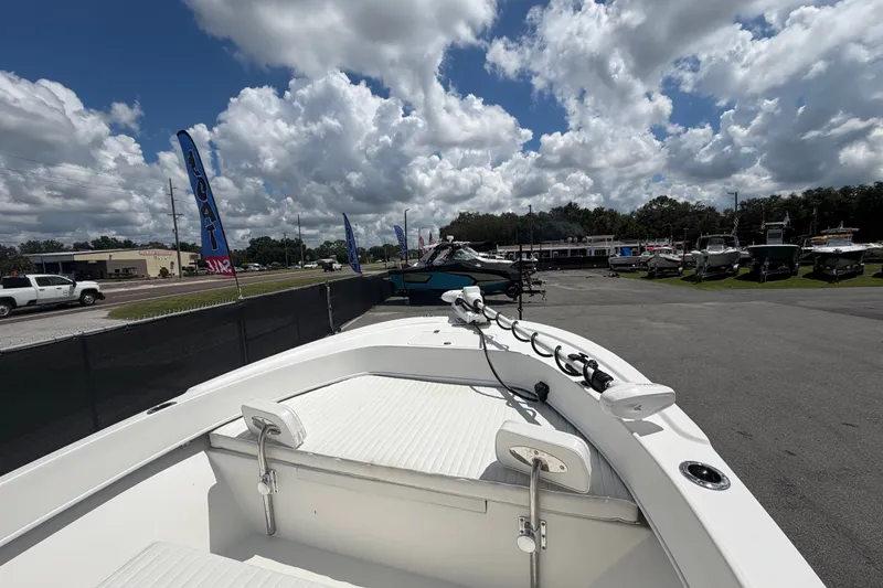 Slide: The Image of 2021 Dusky 227 Open Fisherman boat on display under a partly cloudy sky. - 31