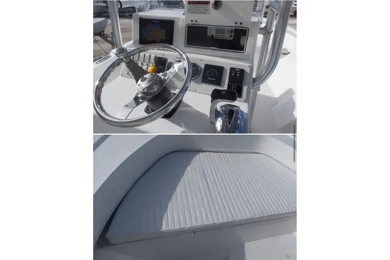 Slide: The Image of 2021 Dusky 227 Open Fisherman boat dashboard and seating area. - 9