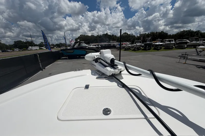Slide: The Image of Dusky 227 Open Fisherman 2021 boat with Garmin equipment, displayed outdoors under cloudy sky. - 37