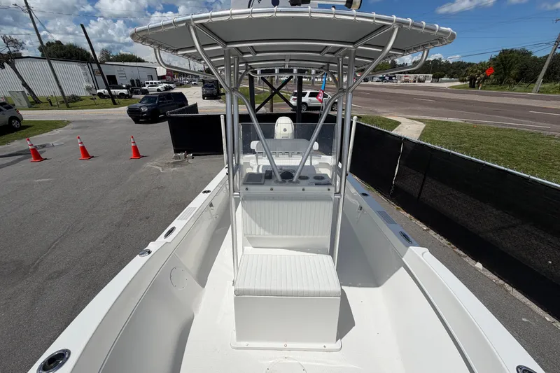 Slide: The Image of 2021 Dusky 227 Open Fisherman boat with T-top, parked outdoors. - 46