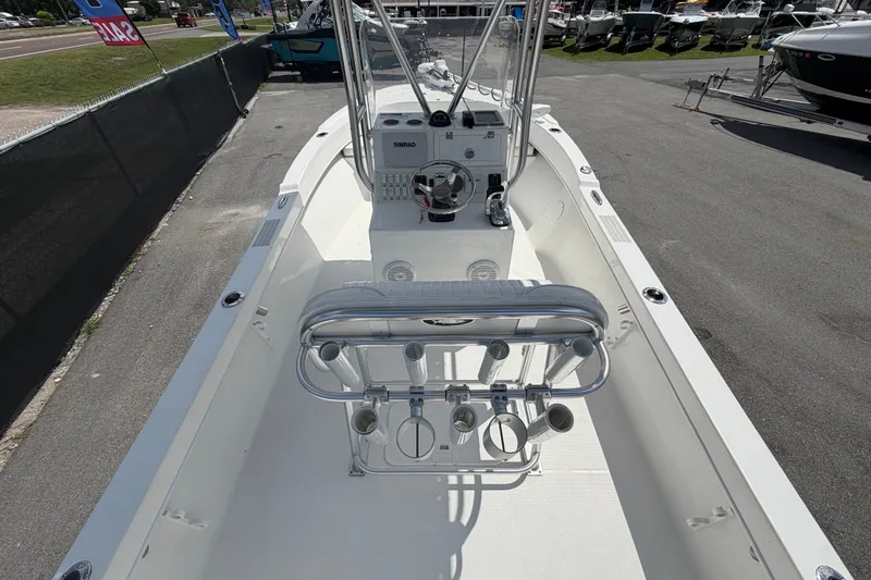 Slide: The Image of 2021 Dusky 227 Open Fisherman boat interior with steering console and rod holders. - 16