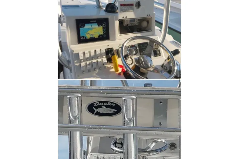Slide: The Image of 2021 Dusky 227 Open Fisherman boat dashboard and logo detail. - 7