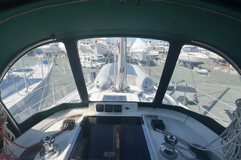 Slide: The Image of Cockpit view of a 1999 Hunter 420 sailboat in a marina. - 4