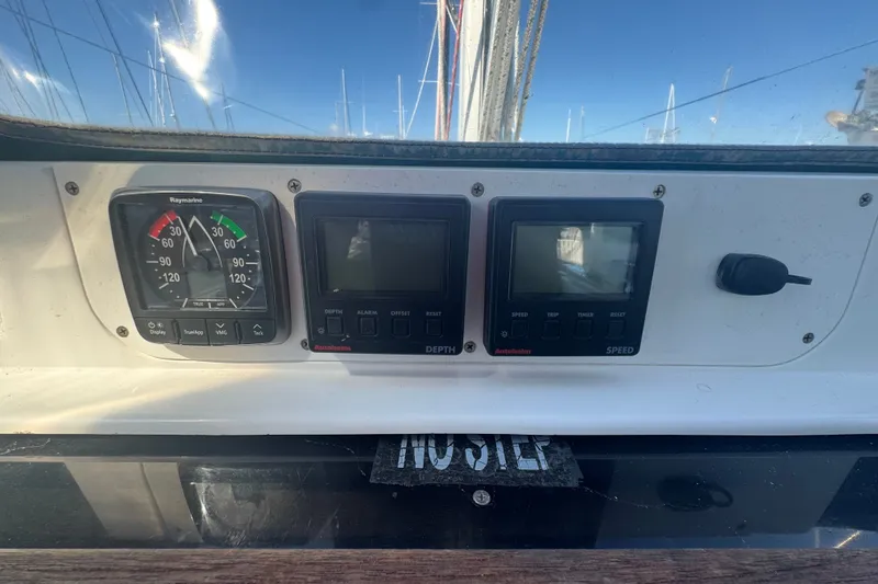 Slide: The Image of Control panel of a 1999 Hunter 420 sailboat with navigation instruments. - 25
