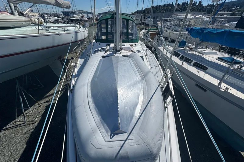 Slide: The Image of Hunter 420 sailboat from 1999 docked among other boats in a marina. - 27