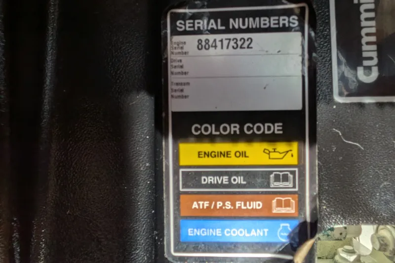 Slide: The Image of Serial number label on 2010 Nordic Tug 32, showing engine oil and fluid color codes. - 53