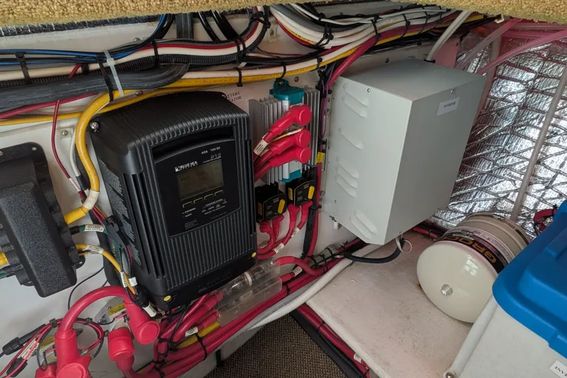 Slide: The Image of Electrical system inside a 2010 Nordic Tug 32, featuring wiring and control panels. - 51