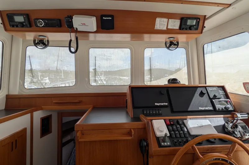 Slide: The Image of Interior helm of 2010 Nordic Tug 32 with Raymarine navigation equipment. - 26
